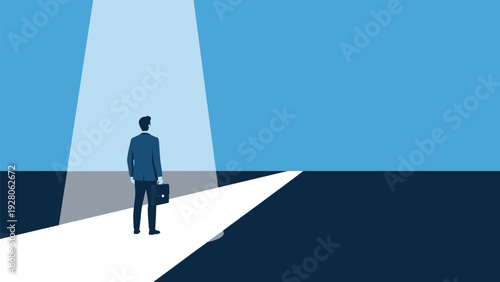 Businessman standing on a white path illuminated by a bright spotlight from above looking toward the dark horizon for his career future.