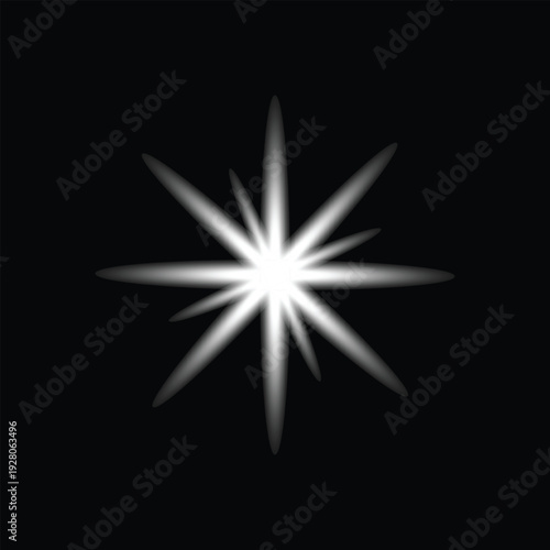 A bright white starburst on a black background