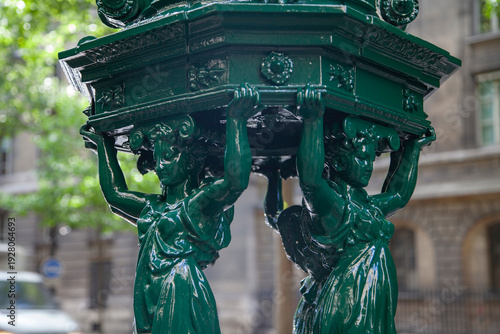 Photos Iconic Green Wallace Fountain with Caryatid Sculptures in Paris with Copy Space