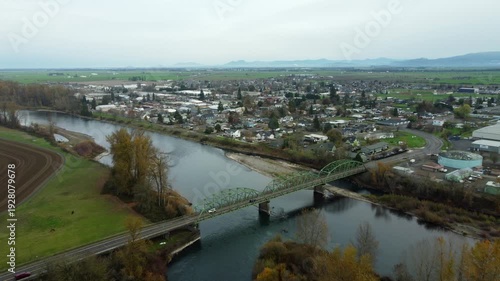 Wallpaper Mural US, OR, Harrisburg, , 2025-11-23 - Drone view of the Wilamette River Iron Bridge on 3rd street with the city and the Wilamette Valley beyond, in fall Torontodigital.ca