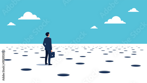 Strategic businessman standing on a vast white plain looking out at a field full of dangerous holes in his path ahead.