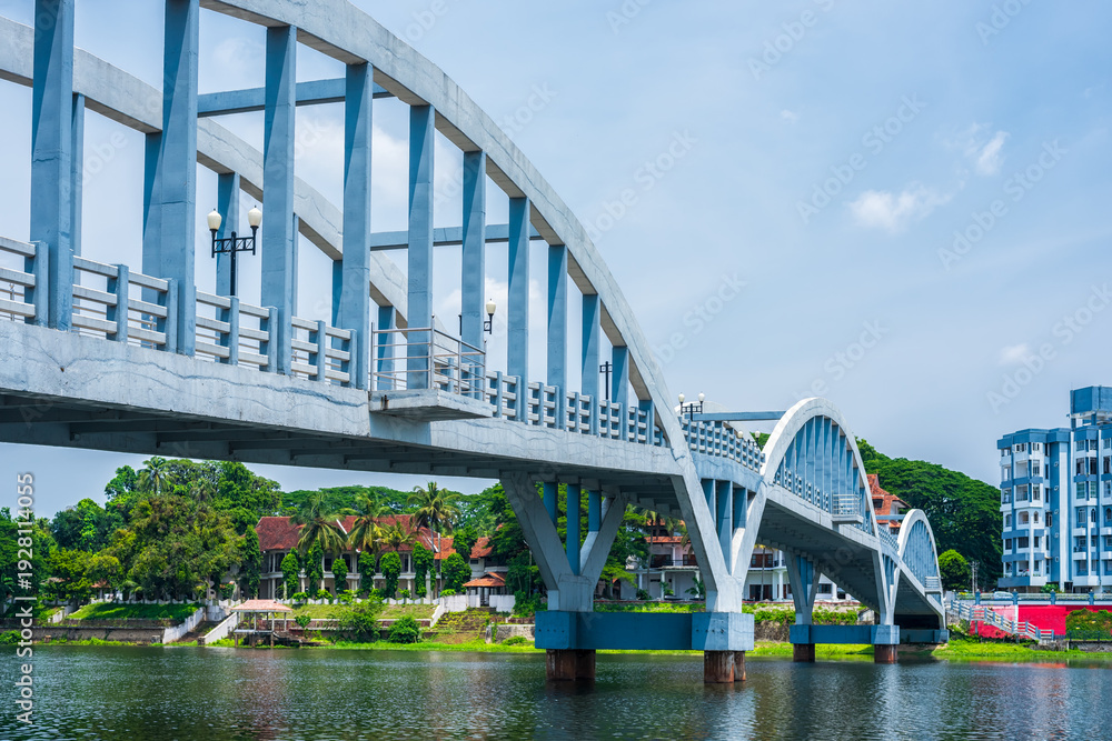 Obraz premium Concrete bridge and river view in Aluva town of Kerala, India.