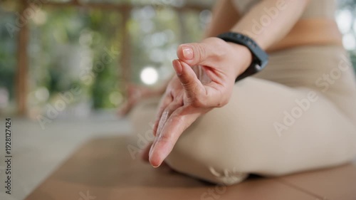 Wallpaper Mural Yoga asian woman meditation hand mudra on mat with fitness tracker, outdoor closeup calm breathing pose, natural light mindfulness wellness balance, soft bokeh background, copy space Torontodigital.ca