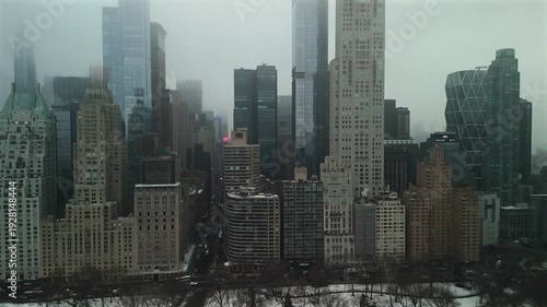 Midtown Manhattan skyline near Central Park South in winter overcast fog