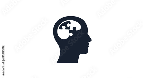 Human Head Silhouette with Puzzle Brain.