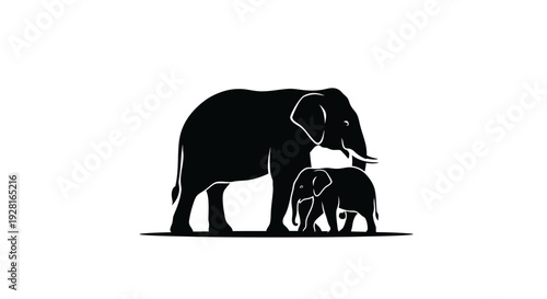 Silhouette of an adult elephant and a baby elephant together.