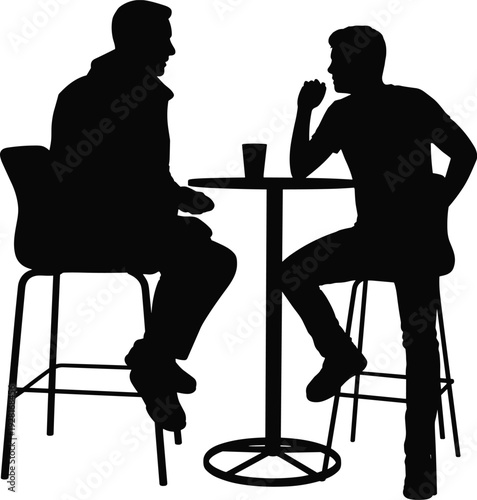 Two men silhouettes chatting at coffee table casual business discussion and friendly meeting conceptTwo men silhouettes chatting at coffee table casual business discussion and friendly meeting concept