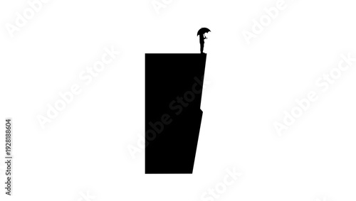 a man stands at the precipice, black isolated silhouette