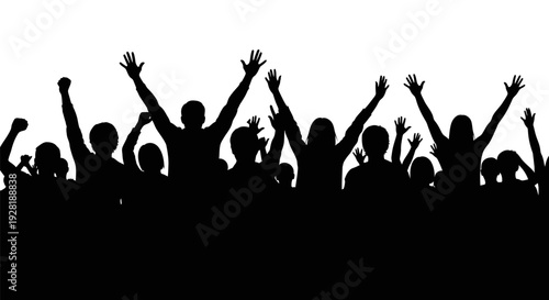 Silhouetted crowd of people raising their hands in celebration.