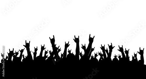 Silhouette of a crowd with hands raised in the air.