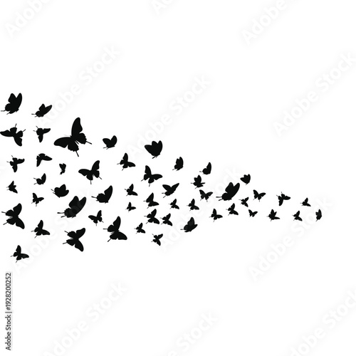 A flock of black butterflies flying in formation