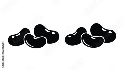 Four black bean shapes arranged in pairs a bold silhouette