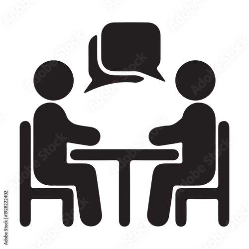 This black and white icon depicts two silhouette figures seated across from each other at a table. Speech bubbles appear between them, indicating a conversation or discussion. 