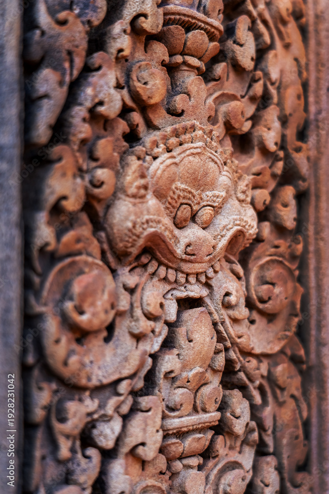 Naklejka premium Detail of bas-relief stone carvings in Banteay Srei temple, the citadel of women in Angkor, Siem Reap, Cambodia