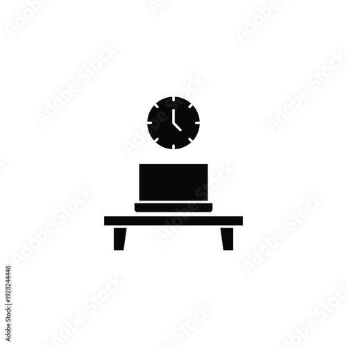 Laptop on Table with Clock.