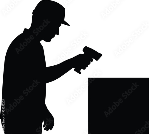 Silhouette of warehouse worker scanning barcode on package with handheld scanner