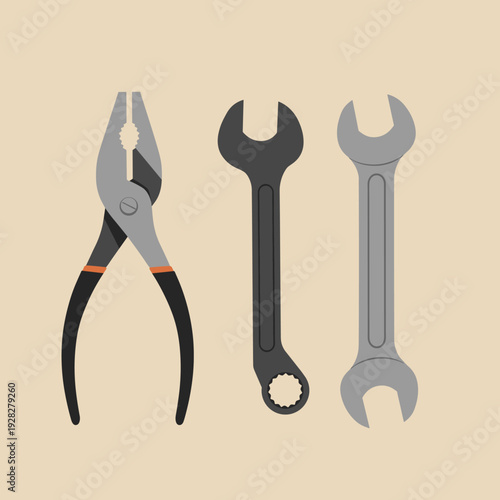 A set of three common hand tools: pliers and two wrenches, displayed against a plain background.