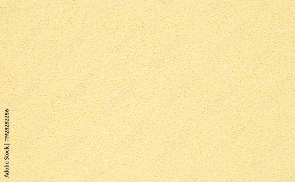 Fototapeta premium Light yellow plastered dry wall texture, light rough chips dry wall texture as background