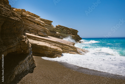Foto Landscape with rocks on Triopetra beach in Crete, where the waves of the Mediter