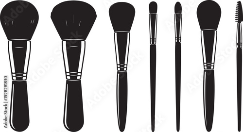 Assorted makeup brushes displayed in a row against a white background