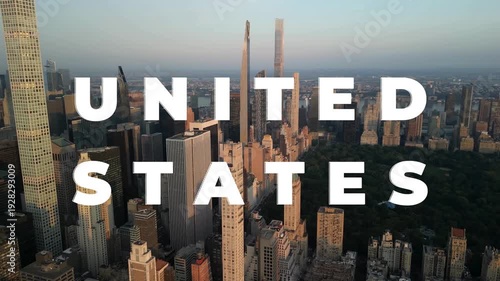Aerial view of a vast modern city skyline with numerous skyscrapers, a green park, and 