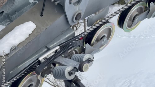 Chamonix France ski lift cable moves over winter pulleys