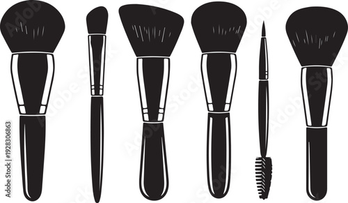 A variety of makeup brushes displayed in a row, showcasing different shapes and sizes.