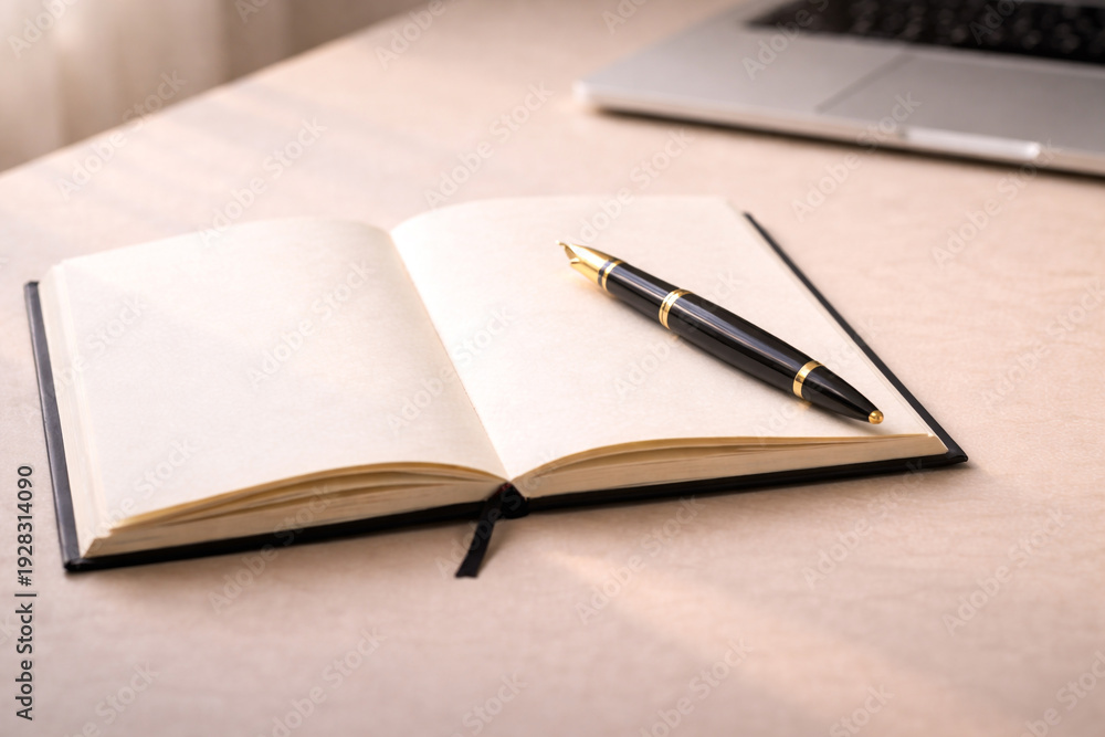 Naklejka premium Open notebook with pen placed across pages, representing writing process, education, learning, planning, and focused intellectual work.