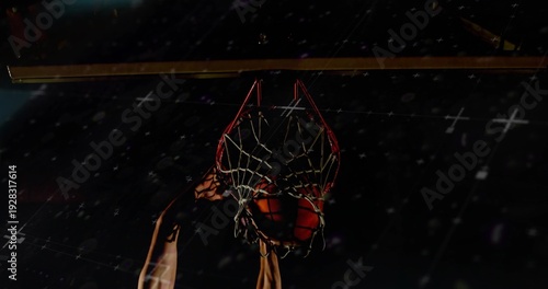 Photos Dunking basketball player powering ball through rim and woven net at gym, sleeve