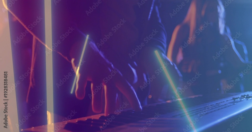 Fototapeta premium Playing musician's hands pressing synth keyboard on club stage, in dark long sleeves, with LED bars