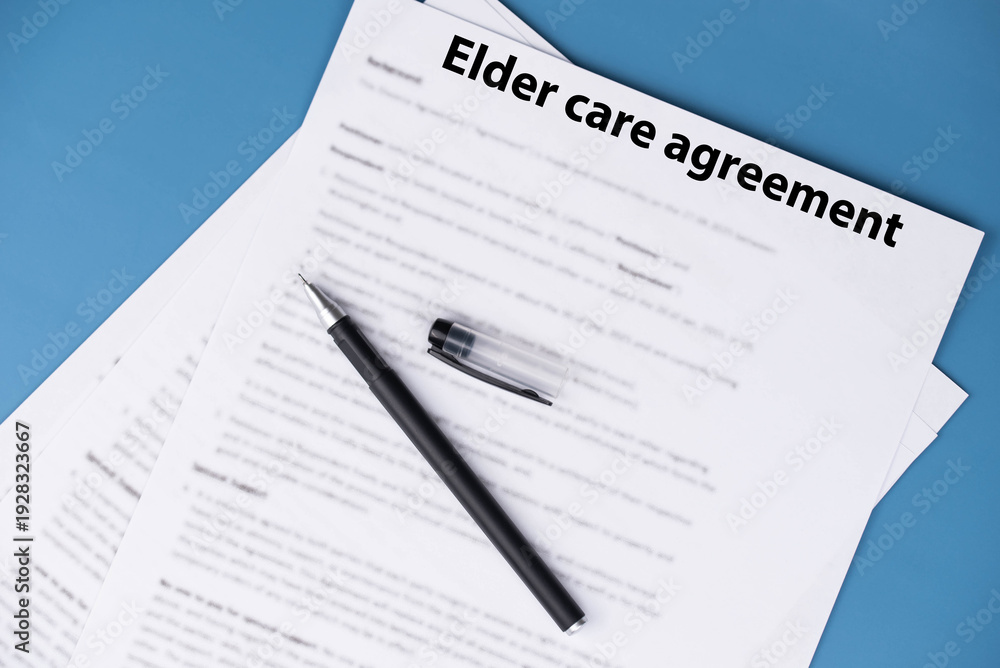 Obraz premium Elder care agreement contract on desk, legal document for senior caregiving services, family support and healthcare responsibility concept.
