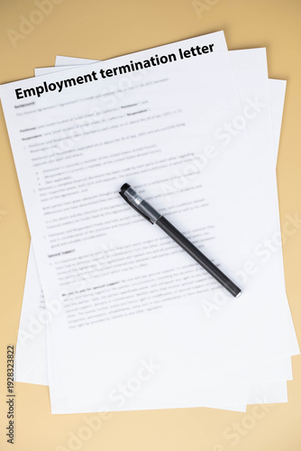 Employment termination letter on office desk, official HR document about job dismissal and career transition, symbol of workplace decision, stress, and change in professional life.