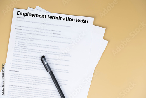 Employment termination letter on office desk, official HR document about job dismissal and career transition, symbol of workplace decision, stress, and change in professional life.