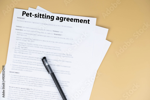 Pet sitting agreement document on desk, legal contract for animal care during owner’s absence, symbol of responsibility, trust, love, and professional pet services.