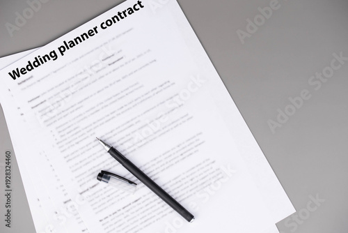 Wedding planner contract on desk, professional legal agreement for event coordination, vendor management and wedding organization, symbol of trust, creativity, and celebration planning success.