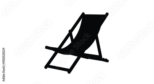 Black beach chair depicted in a dramatic stark silhouette