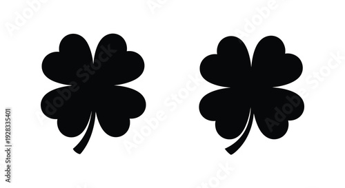 Two black clover shapes against a white background a bold silhouette