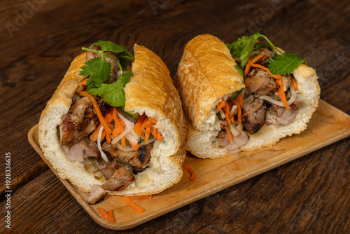 Chicken Banh Mi Sandwich on dark wood