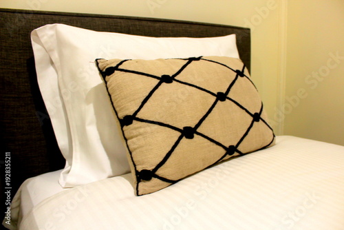 Closeup picture of two cushions on the bed