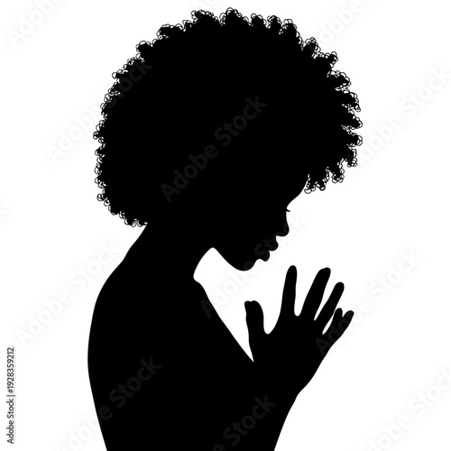 Silhouette of a contemplative person with afro hair lost in thought facing profile view