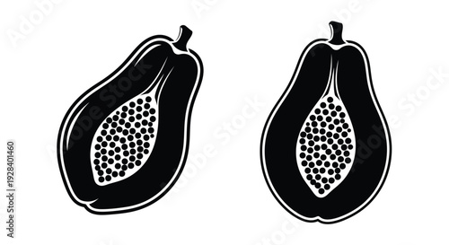 Two halved papayas shown in a striking black silhouette