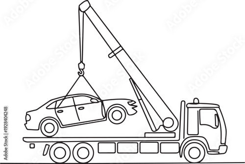 Tow truck lifting a car onto its flatbed in a rescue operation on a highway