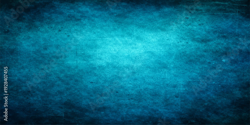 A vintage grunge blue paper texture backdrop with a dirty aged design and copy space