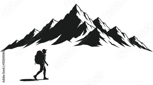 Hiker in silhouette standing before majestic mountain range silhouette