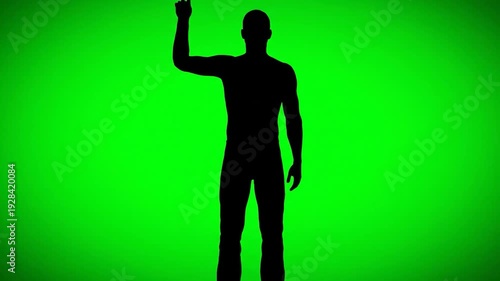 Black silhouette of a man standing against a bright green background