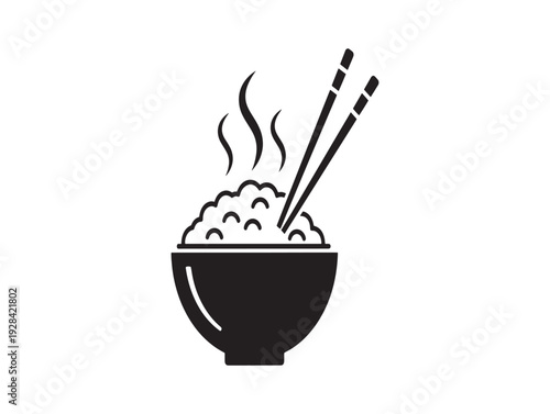 Steaming bowl of rice with chopsticks