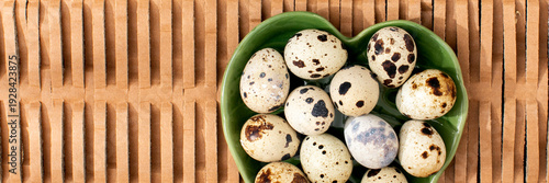 Quail eggs nestle in a verdant heart-shaped bowl, invoking vernal equinox rituals and spring gastronomic adventures