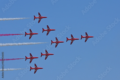 Ickwell, Bedfordshire, England - June 28 , 2025:  Red Arrows in formation flight blue sky