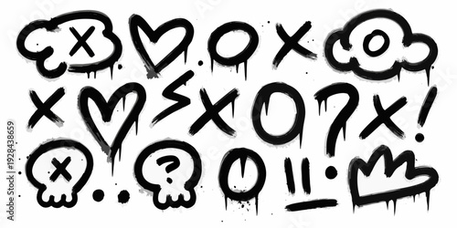 Black and white spray paint graffiti with various symbols and characters