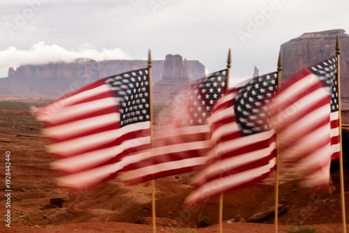 Monument Valley, Utah, USA.American flags blowing in the wind. Motion blur image